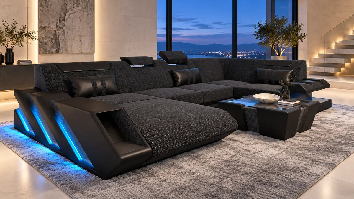 Apollonia Möbelserie – Sofa Dreams Wohnlandschaft mit Couchtisch und blauer LED-Beleuchtung